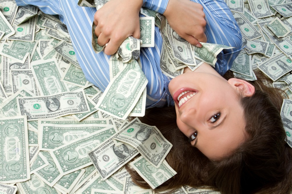 http://www.yourmoney.com/wp-content/uploads/sites/3/oldimg/2221491-woman-lying-in-money-1024x682.jpg