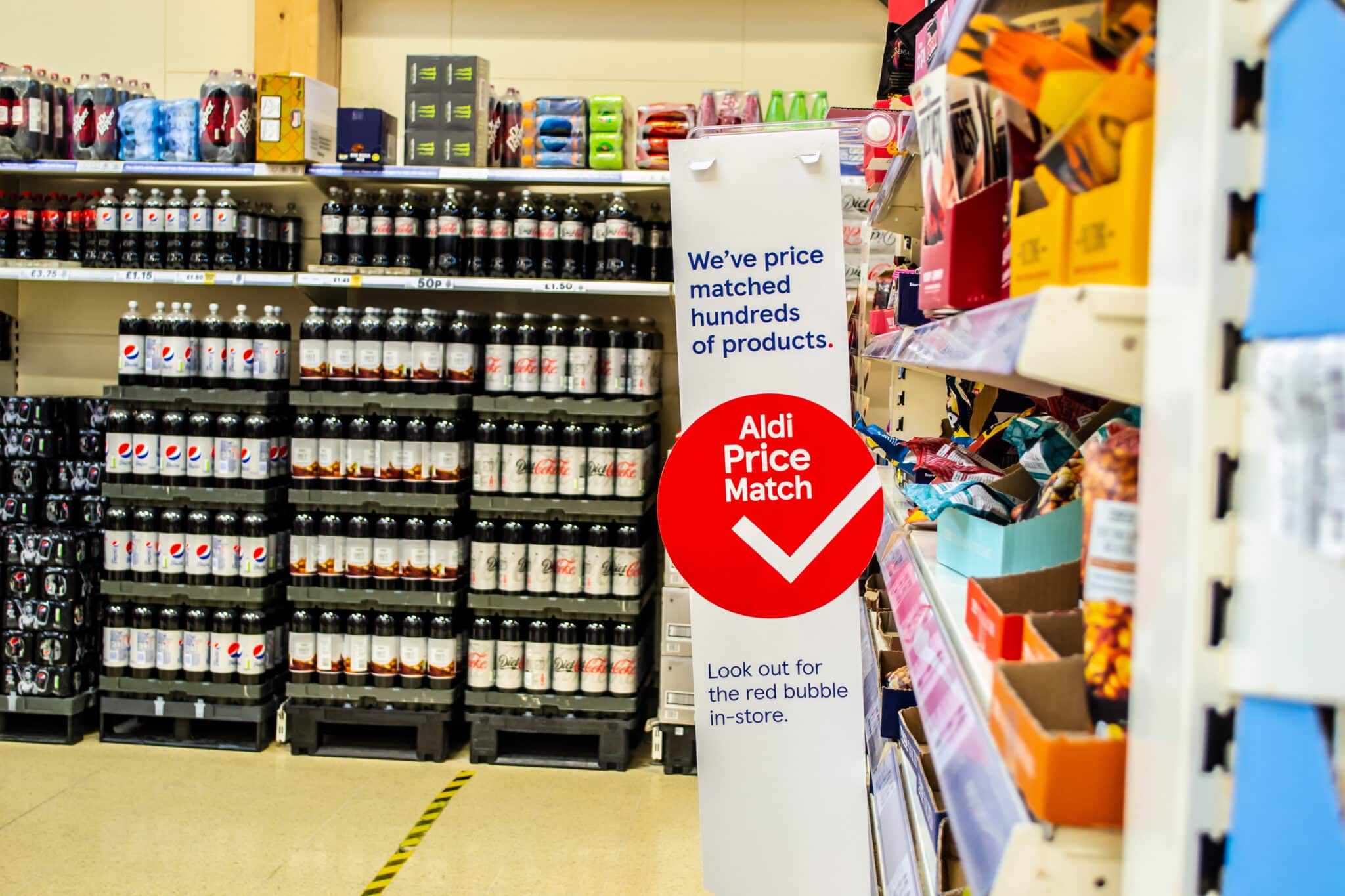 An aisle of a tesco store to denote the Tesco aldi price match not being like for like